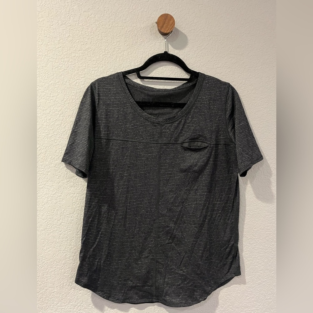 Lululemon. 8?  Grey stripes. Good condition. Front pocket